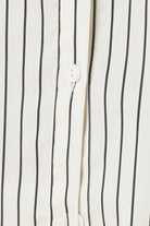 Close up of top of a ivory pin striped willow cotton stripe pyjama PJ set showing white buttons and seam