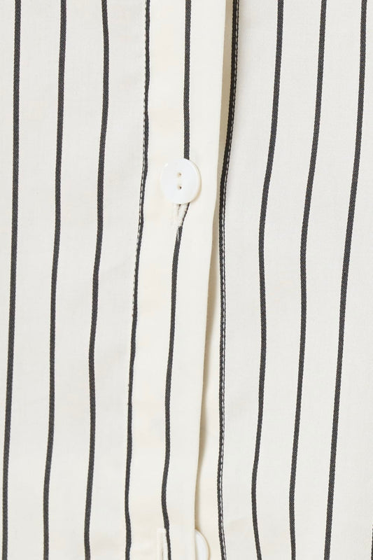 Close up of top of a ivory pin striped willow cotton stripe pyjama PJ set showing white buttons and seam