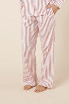 Willow Cotton Striped Pyjama Pants in Pink worn by a person on a beige background
