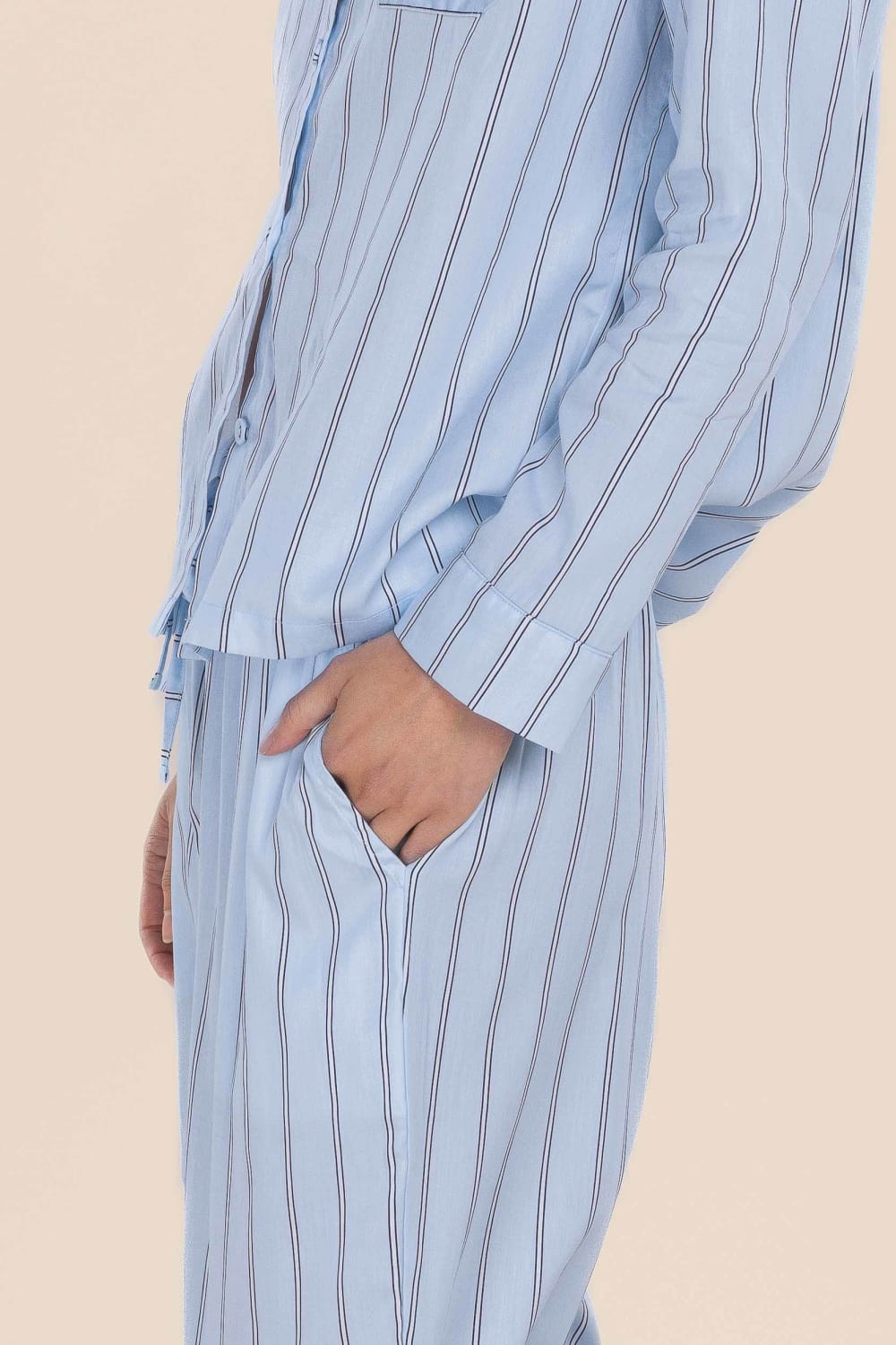 Light blue pinstripe shirt with a beige background