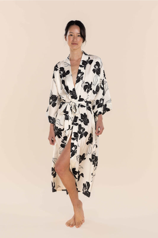 Woman wearing a floral robe on a beige background