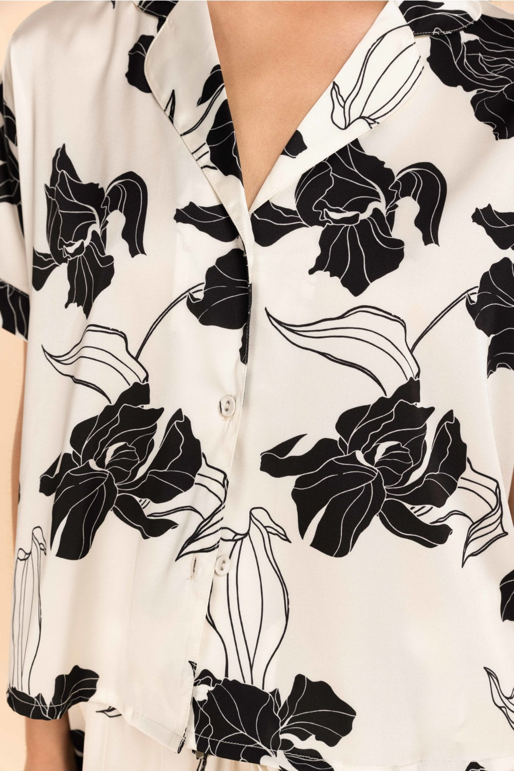 White blouse with black floral patterns