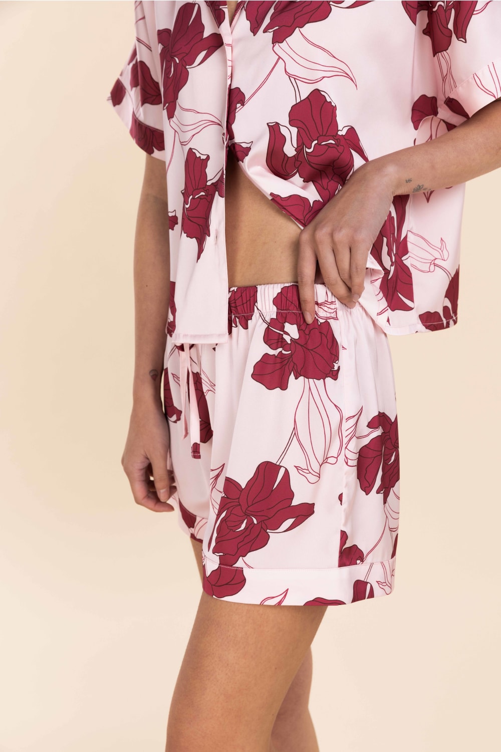 Floral patterned outfit on a beige background