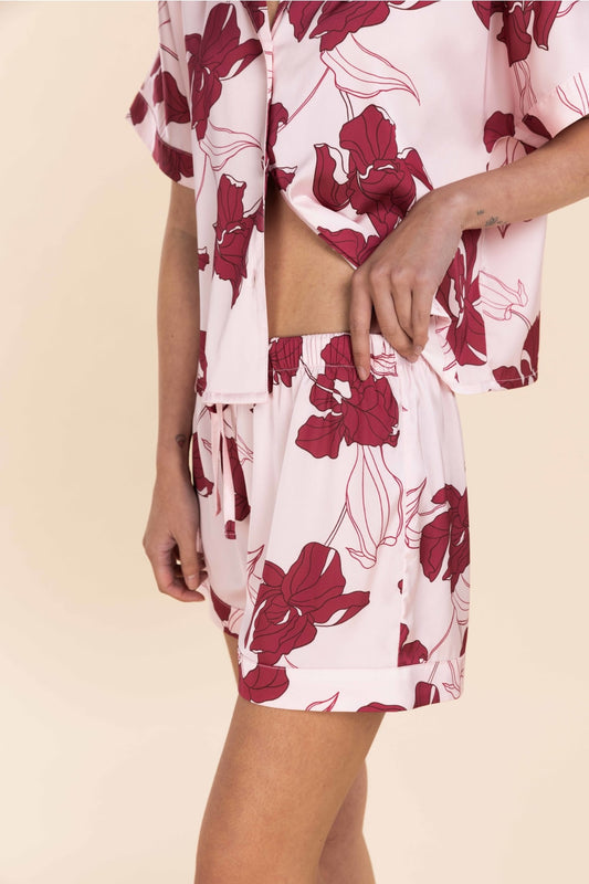 Floral patterned outfit on a beige background