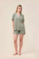 Woman wearing the Allegra Short Bamboo PJ Set in Olive, front view with white contrast trim