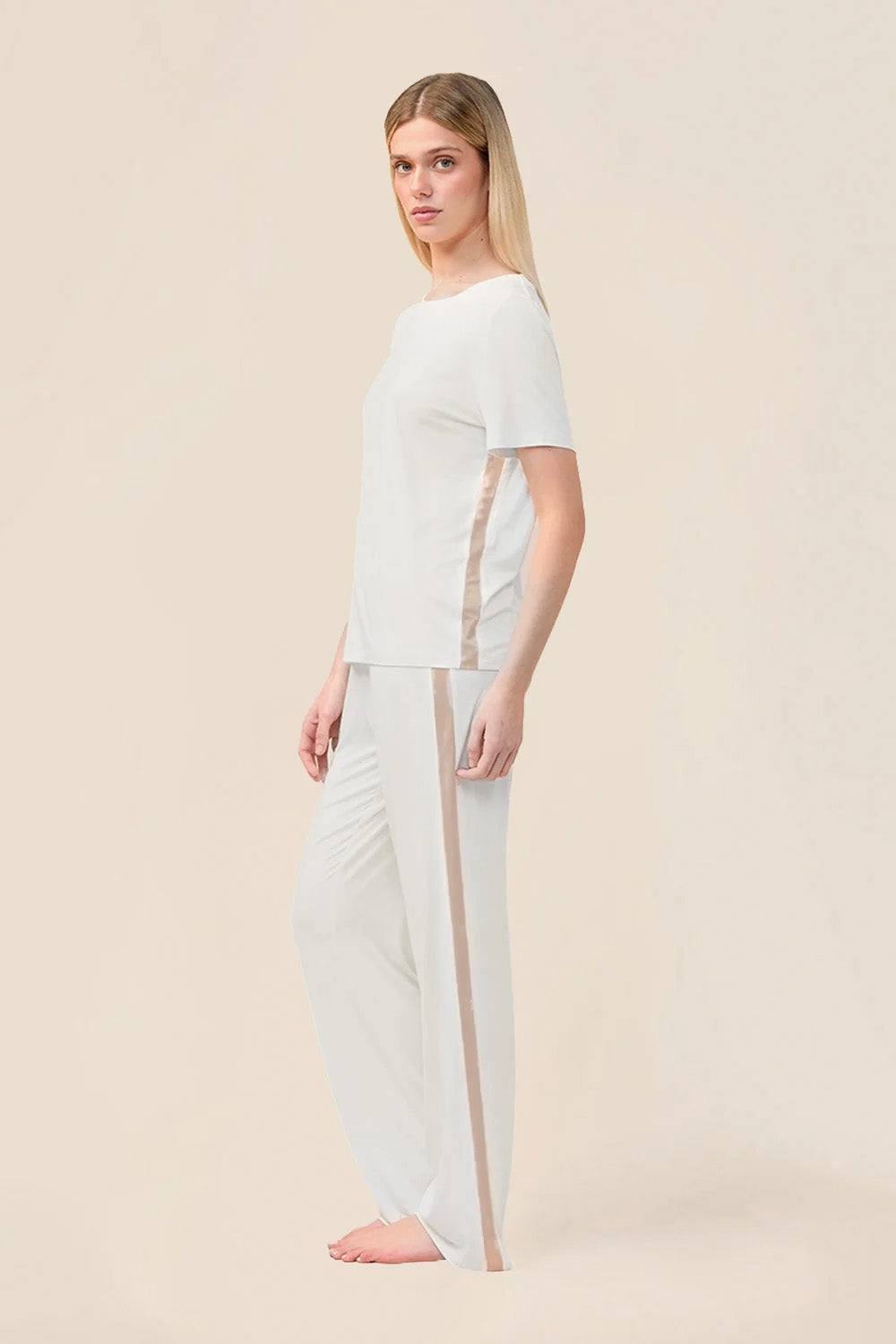 Woman wearing the Bronte Bamboo T-Shirt with Stripe in Ecru, side view