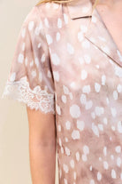 Close-up of the Lydia Bambi Print Short Set in Brown, showing the collar and lace-trimmed sleeve