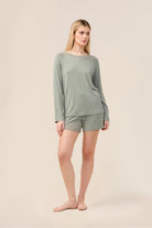 Woman wearing the Solene Long Sleeve Top with Stripe in Olive, front view