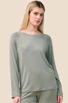 Woman wearing the Solene Long Sleeve Top with Stripe in Olive, close front view
