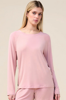 Woman wearing the Solene Long Sleeve Top with Stripe in Pink, close front view