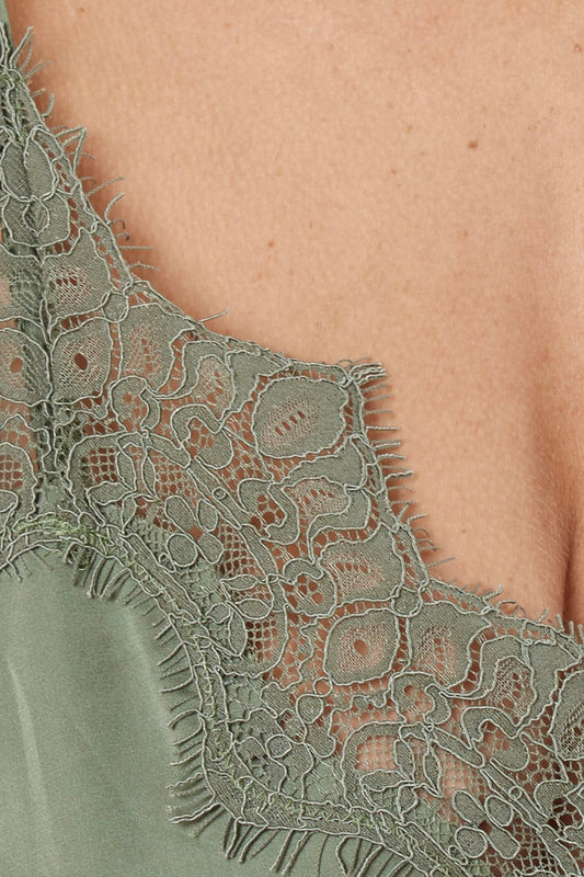 Close-up of a olive green heather silky satin cami and short set lace garment