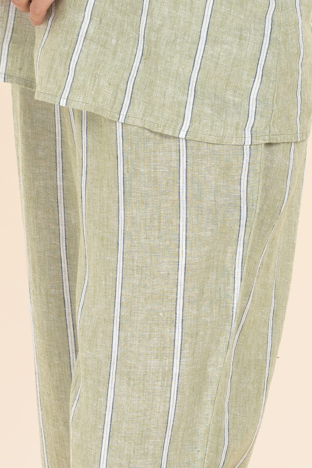 Green striped pants with a beige background