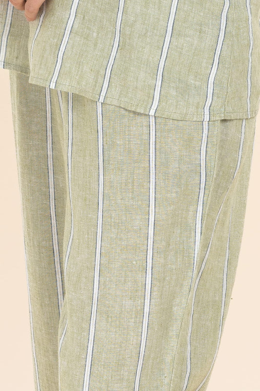 Green striped pants with a beige background